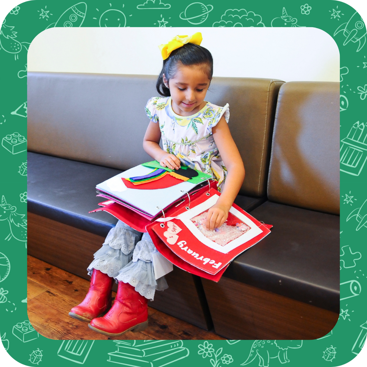 Child reading and playing with Calendar Quiet Book.