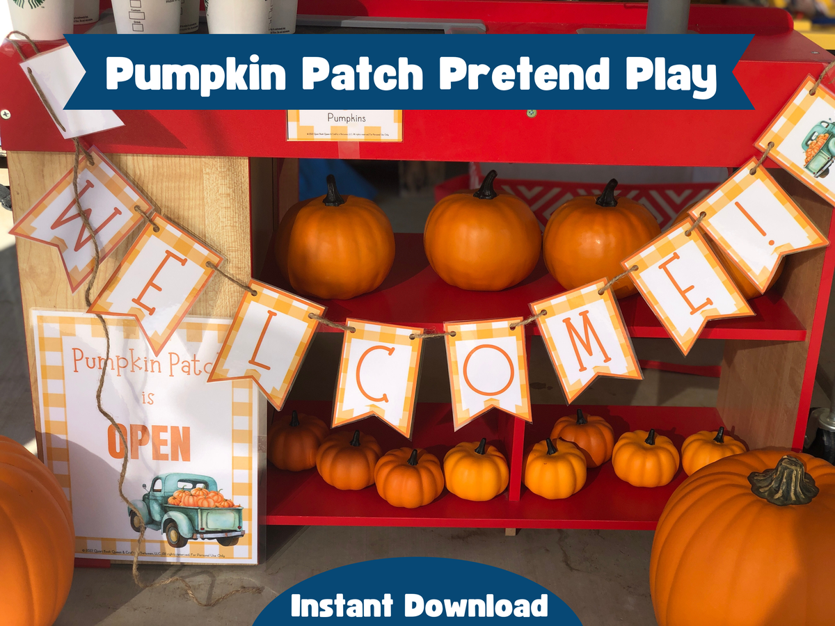 Pumpkin patch pretend play setup with pumpkins, a welcome banner, and 'Pumpkin Patch is Open' sign.