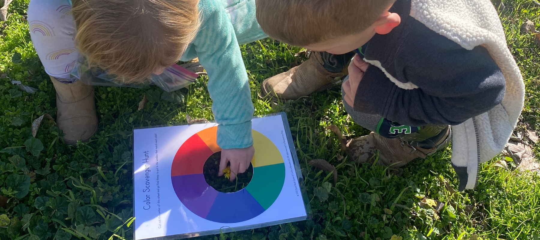 Children playing with an Inner Circle activity -- Color Scavenger Hunt